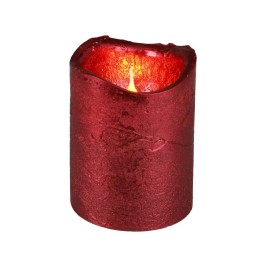 Bougie rouge, texture rustique, lumière chaleureuse émanant d'un sommet irrégulier.