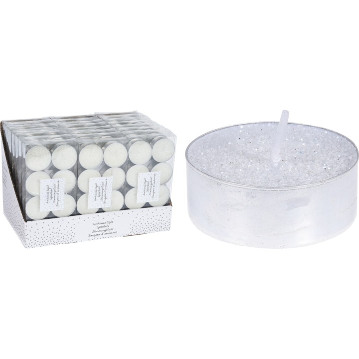 Bougies blanches en forme de disque, accompagnées d'une grande bougie décorée de paillettes.