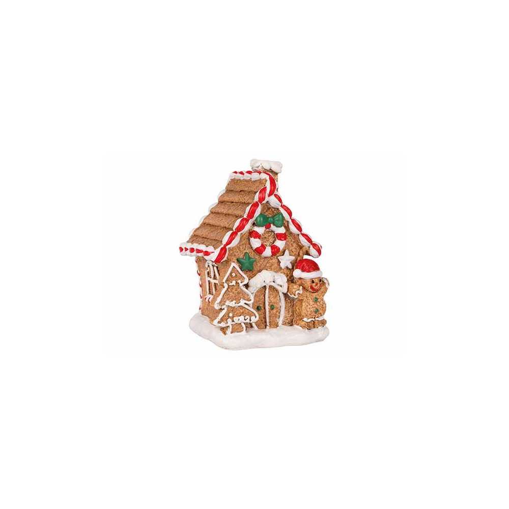 Maison en pain d'épices décorée, couleurs vives et motifs festifs, ambiance chaleureuse.