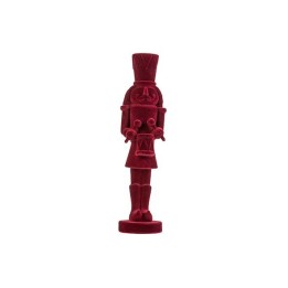 Figurine de soldat en bois sculpté, peinte en rouge vif, avec chapeau haut et tambour.