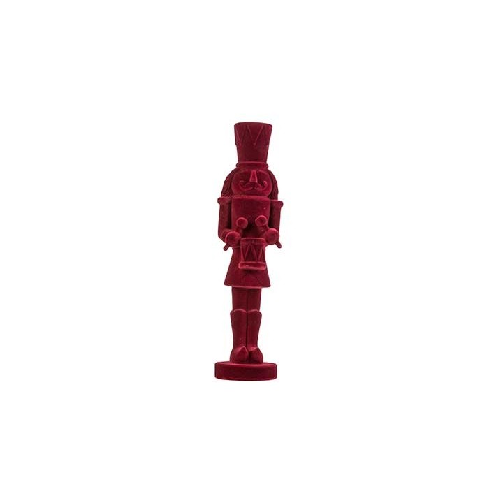 Figurine de soldat en bois sculpté, peinte en rouge vif, avec chapeau haut et tambour.