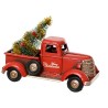 Camion rouge vintage avec un sapin décoré pour Noël à l'arrière. Camion rouge vintage avec un sapin décoré pour Noël à l'arrière.