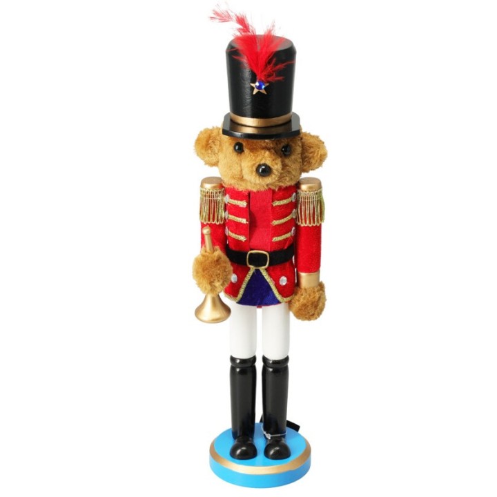 Ourson en uniforme de soldat, rouge et noir, avec un chapeau haut et un clairon doré.