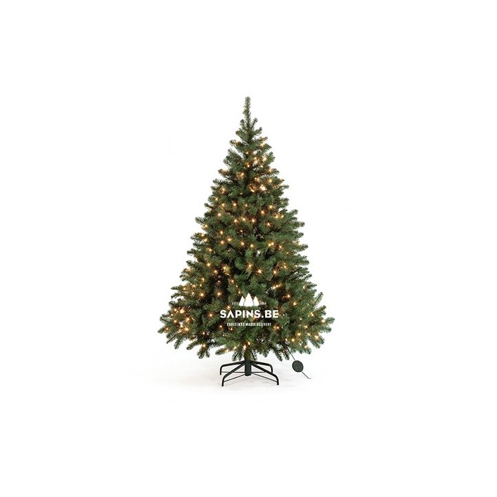 Arbre de Noël artificiel vert, décoré de lumières brillantes, posé sur un support noir.