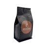 Sachet noir élégant avec un logo rond marron, design moderne pour café. Sachet noir élégant avec un logo rond marron, design moderne pour café.
