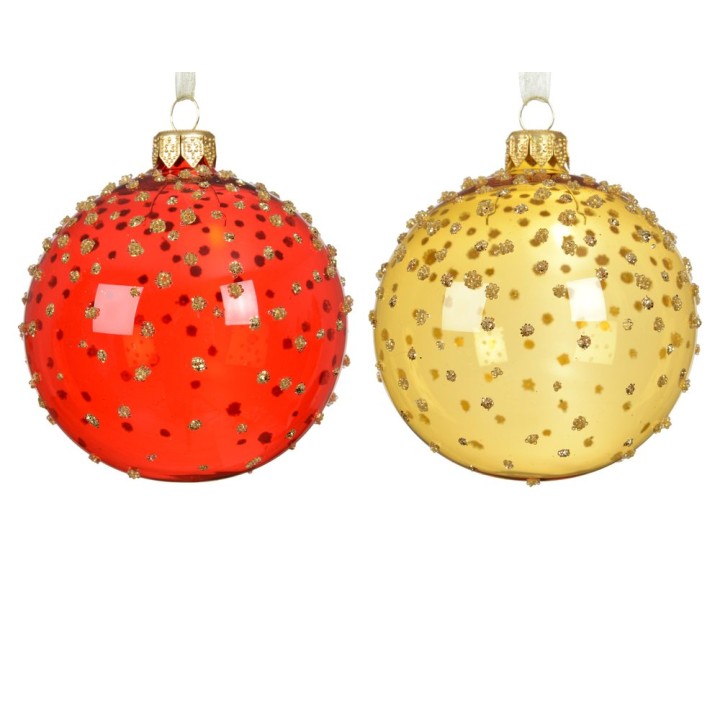 Boules de Noël brillantes, l'une rouge et l'autre dorée, ornées de paillettes.