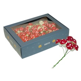 Boîte contenant des champignons décoratifs rouges et blancs, style ludique et festif.
