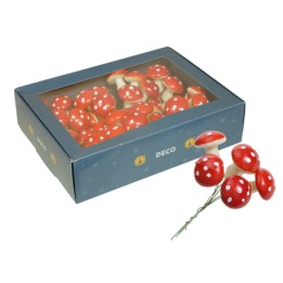 Des champignons décoratifs rouges à pois blancs, présentés dans une boîte élégante.