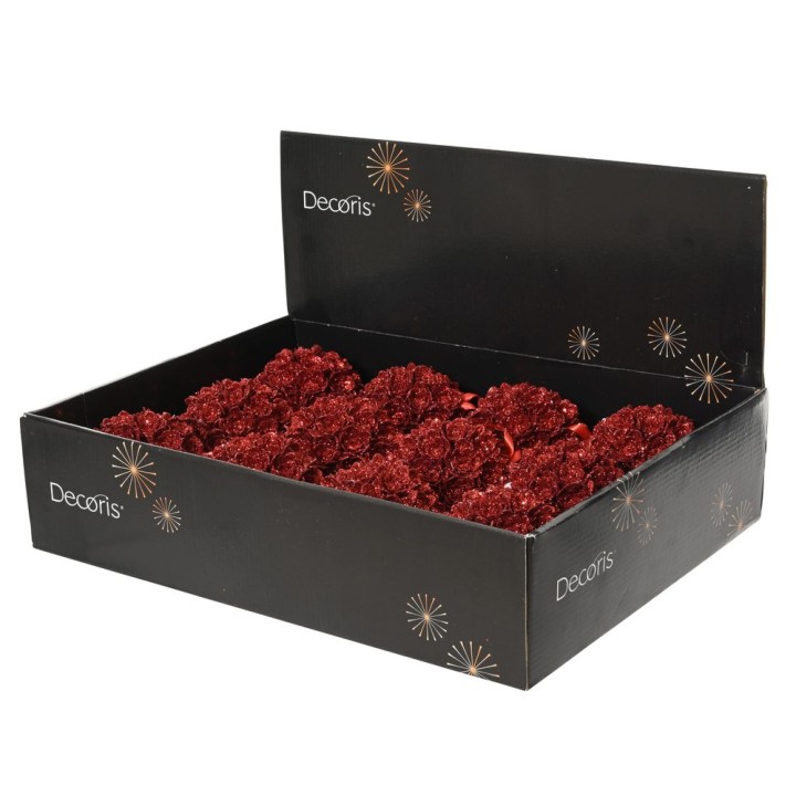 Boîte noire contenant des fleurs rouges scintillantes en décoration.