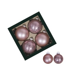 Boules de Noël roses, brillantes, disposées dans une boîte noire élégante.