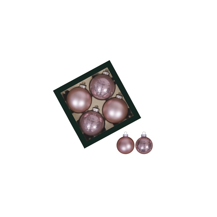 Boules de Noël roses, brillantes, disposées dans une boîte noire élégante.