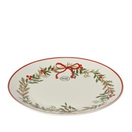 Assiette ovale blanche ornée d'un motif festif de feuillage et d'un nœud rouge.