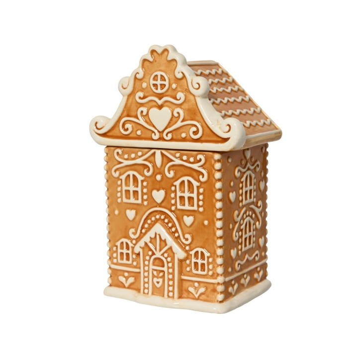 Maison en pain d'épice ornée de motifs délicats, teintes caramel et crème.