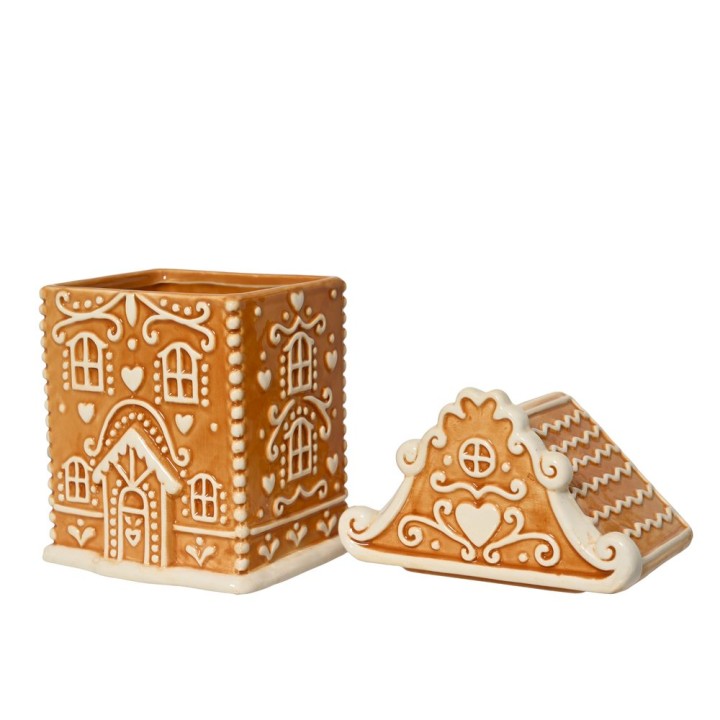 Maisons en pain d'épice en céramique, dorées et ornées de motifs délicats.