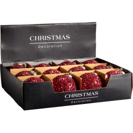 Douze boules de Noël rouges pailletées dans une boîte élégante.