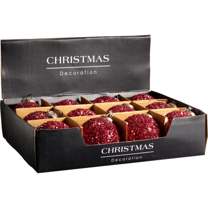Douze boules de Noël rouges pailletées dans une boîte élégante.