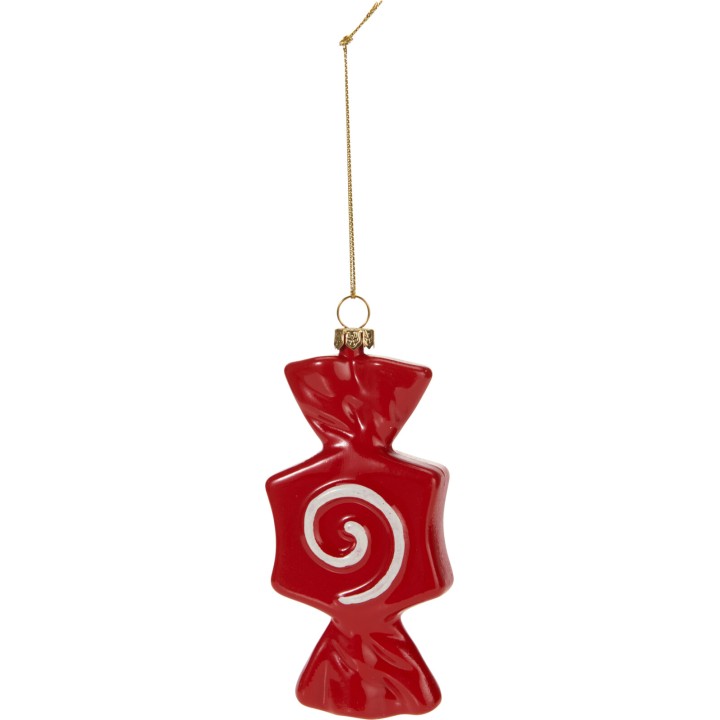 Ornement en verre rouge en forme de bonbon avec un motif en spirale blanche.