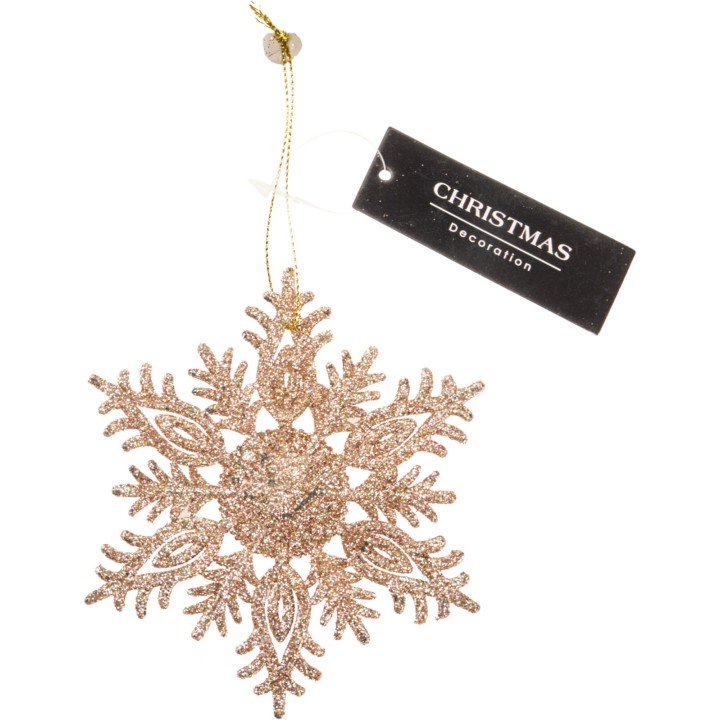 Flocon de neige doré scintillant, suspendu par un fil, étiqueté décoration de Noël.
