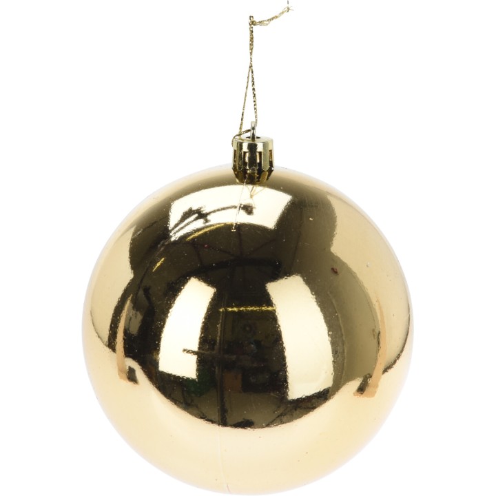 Boule dorée brillante avec une surface lisse et réfléchissante, suspendue par un fil.