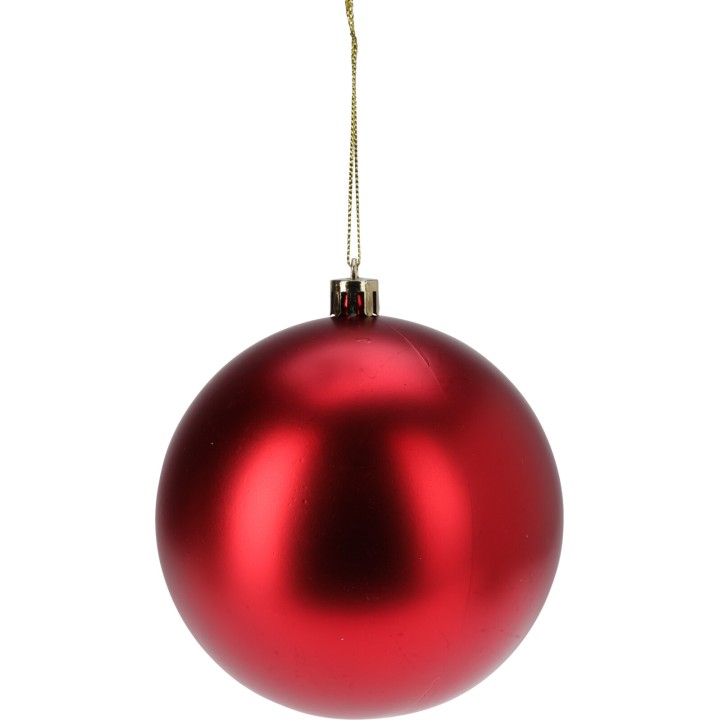 Boule de Noël rouge brillante suspendue par un fil doré, reflet lisse et éclatant.