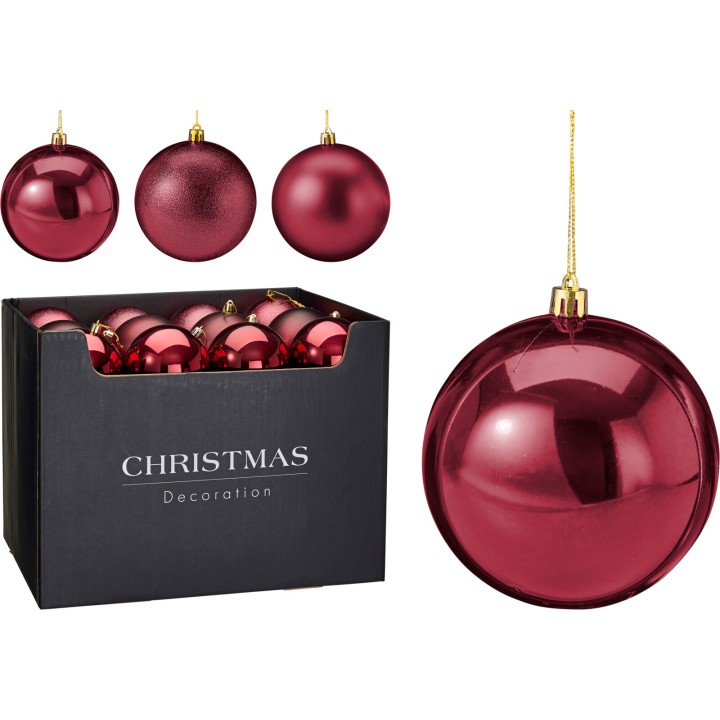 Boules de Noël rouges brillantes dans une boîte noire élégante.