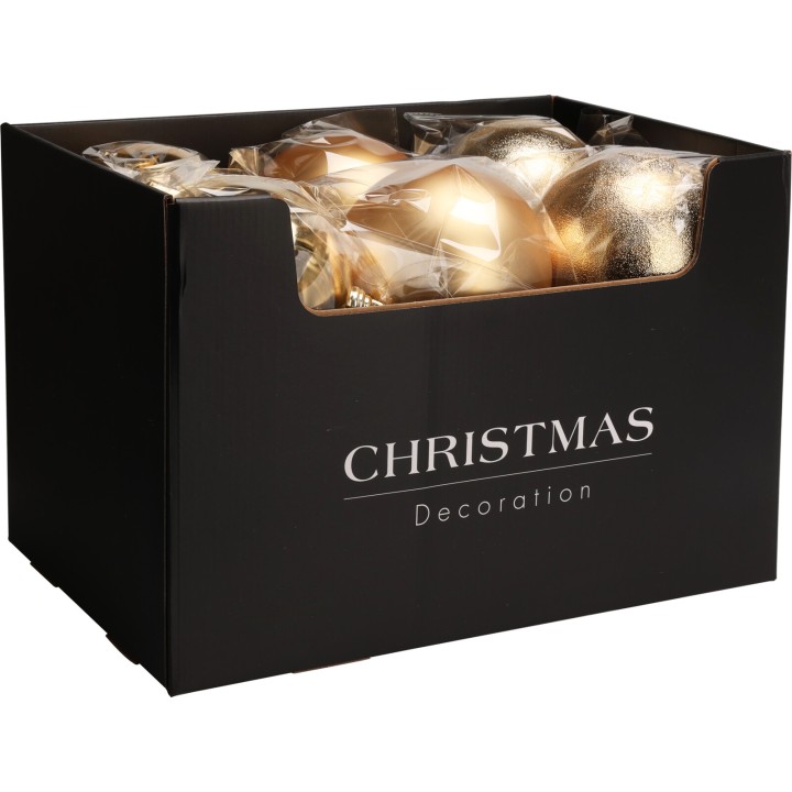 Boîte noire contenant des ornements dorés scintillants pour les fêtes de fin d'année.