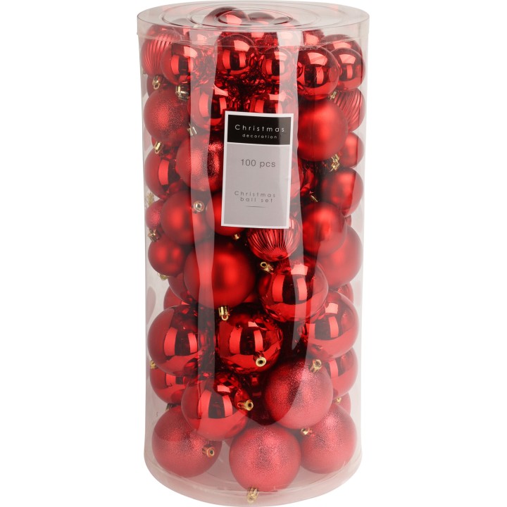 Boules de Noël rouges brillantes, regroupées dans un tube transparent.