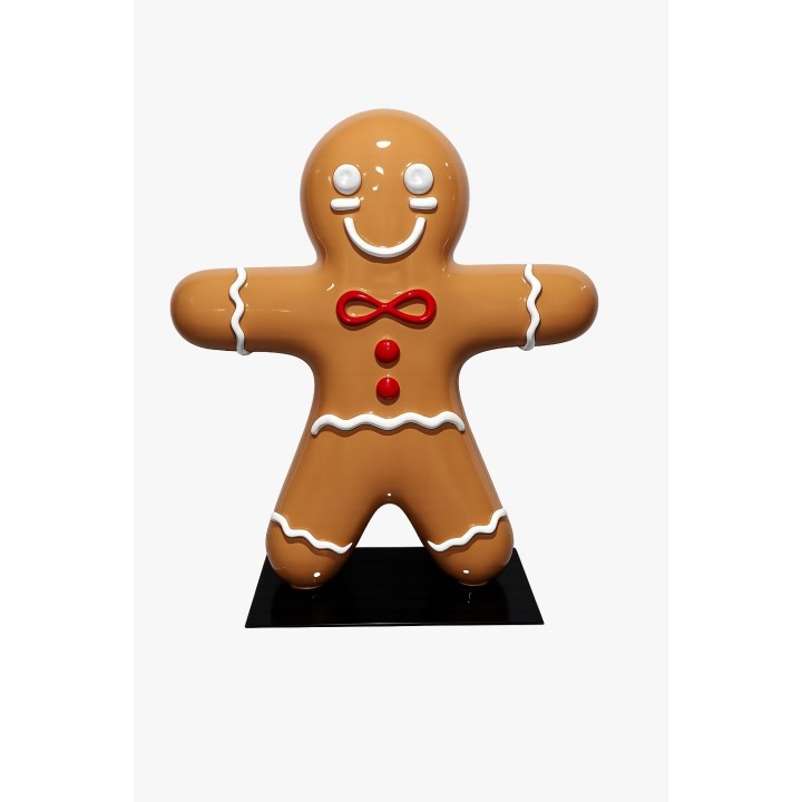 Bonhomme en pain d'épices en plastique, couleur caramel, décoré de rouge et blanc.