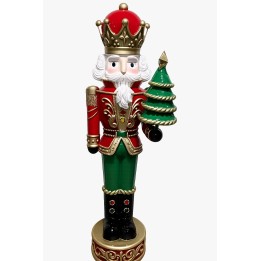 Poupée de Noël colorée, portant une couronne, tenant un sapin, en bois peint.