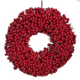 Couronne rouge composée de baies brillantes, forme ronde, festive et chaleureuse.