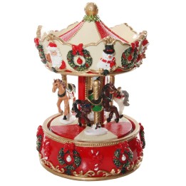 Carrousel festif orné de motifs de Noël, avec chevaux miniatures et couleurs vives.