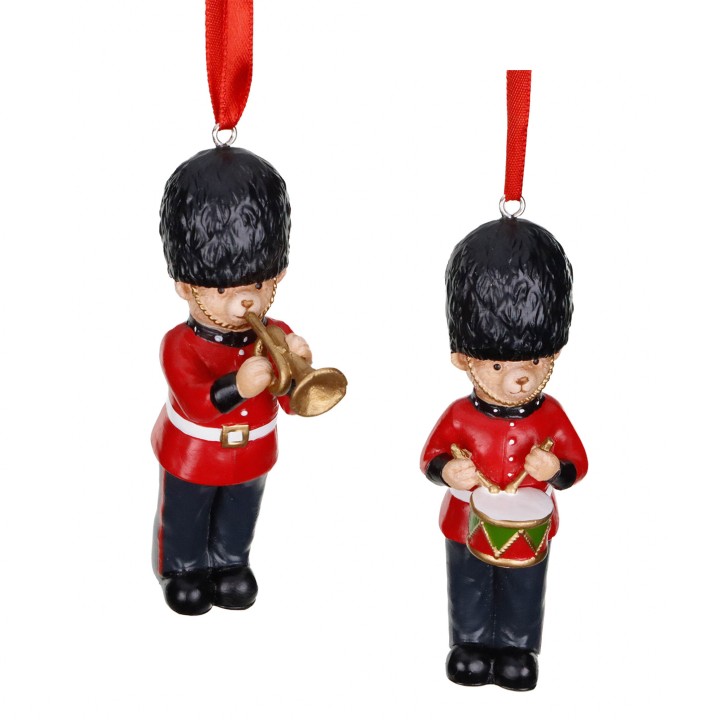 Figurines de soldats en uniforme rouge, jouant de la trompette et de la batterie.