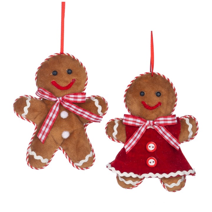 Deux biscuits en pain d'épice en feutre, l'un habillé d'une robe rouge, sourires joyeux.