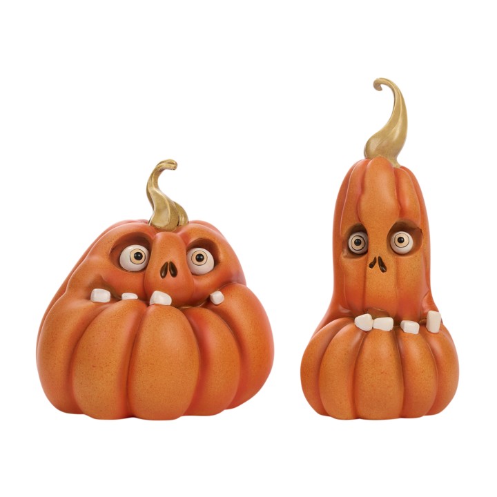 Deux citrouilles expressives, orange vif, avec des visages amusants et des dents blanches.